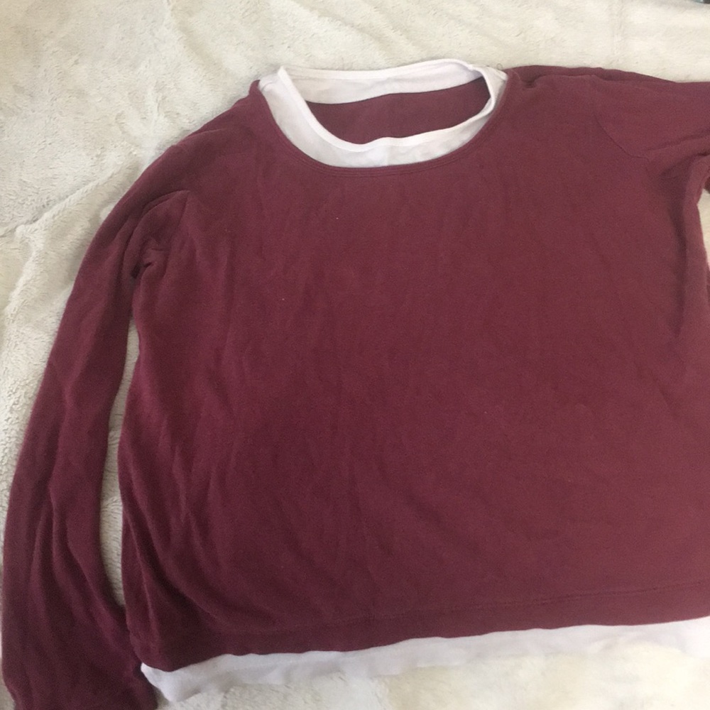 A long sleeve maroon shirt
